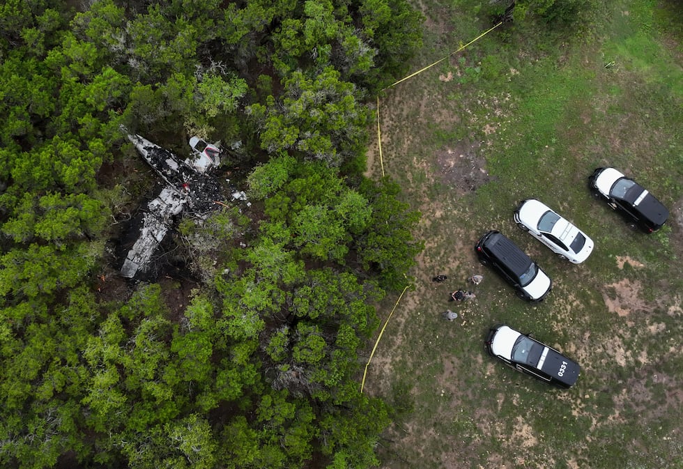 A crashed Cessna airplane is seen in a wooded area on Round Rock Road in Wimberley, Texas,...