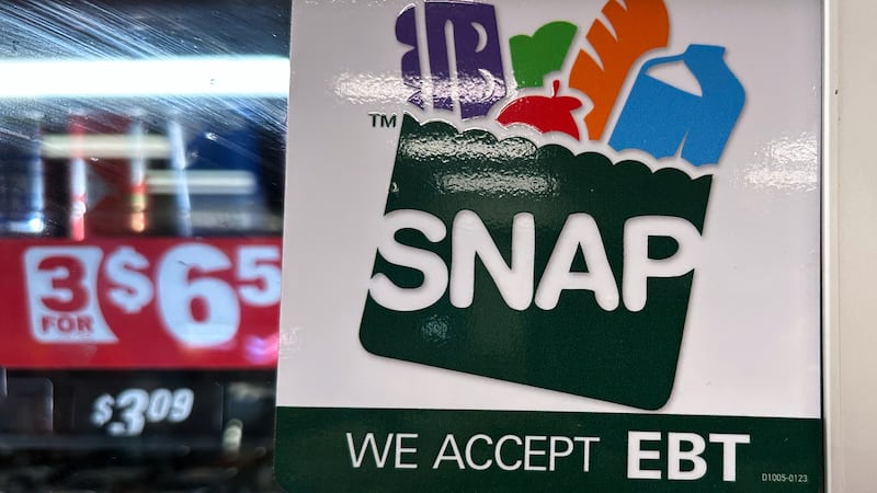 FILE - SNAP EBT information sign is displayed at a gas station in Riverwoods, Ill., Saturday,...