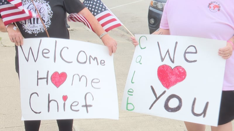PROCESSION TODAY: Community lines streets as fire chief Caleb Miller brought home