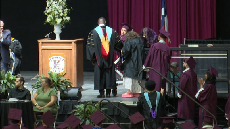 Sean Roberts, KISD student with special needs, walks stage at graduation