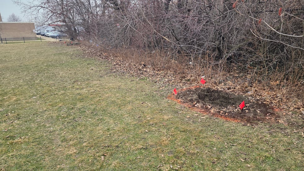 Police said both suitcases were partially buried in shallow graves.