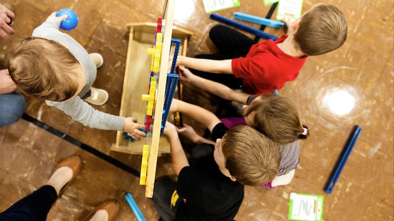Children play with activity during North Iowa Children’s Museum event. Photo by Juliana Sabo.