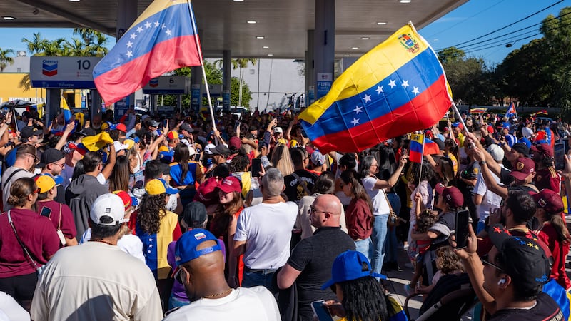 People celebrate after President Donald Trump announced Venezuelan President Nicolás Maduro...