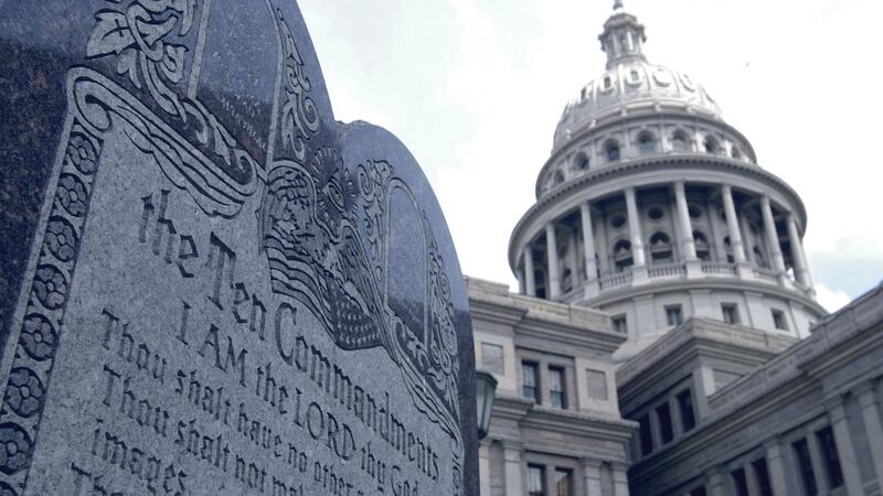 FILE - This 5-foot tall stone slab bearing the Ten Commandments stands near the Capitol in...