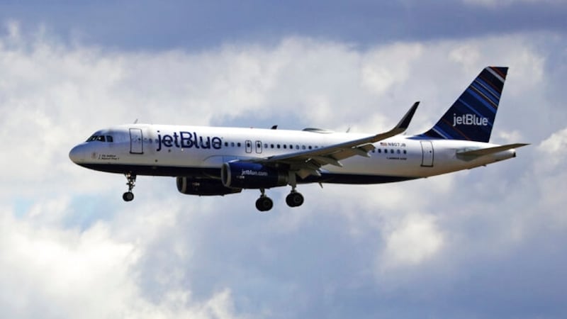 An JetBlue Airways flight flies in to Salt Lake City International Airport Friday, Oct. 18,...