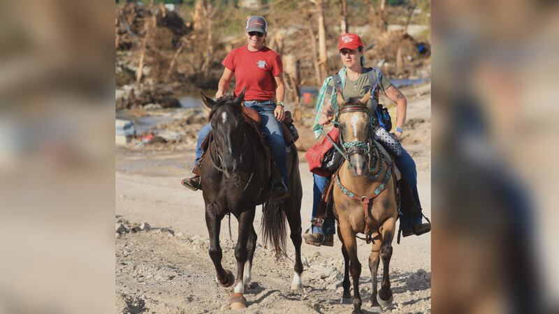 Angelina (left) and Leilani Cain search the flood zone on horseback in Hill Country
