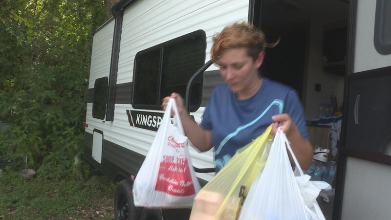 Valerie Drew prepares her home to be moved in compliance with an evacuation order issued by...